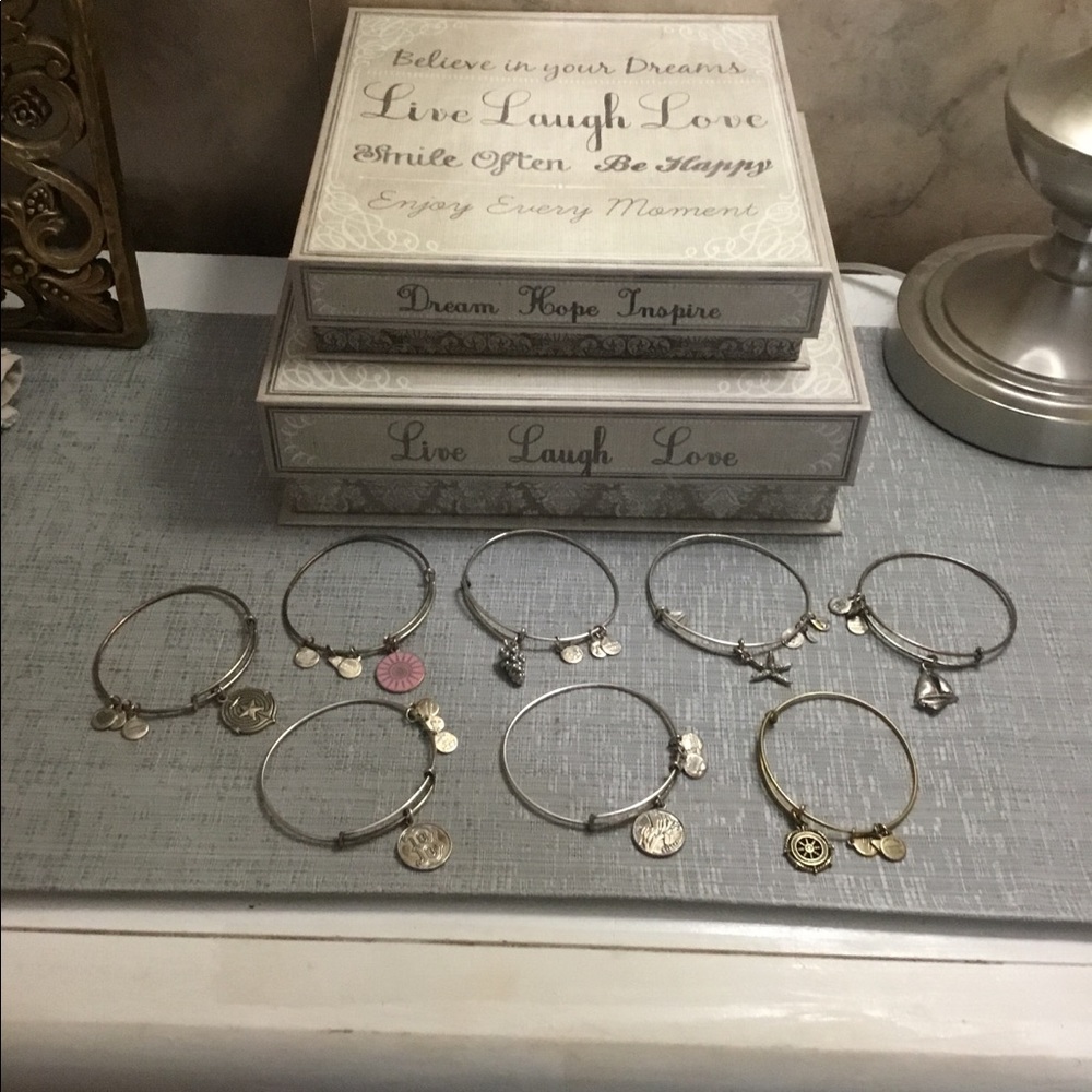 Group of 8 Alex and Ani bracelets.